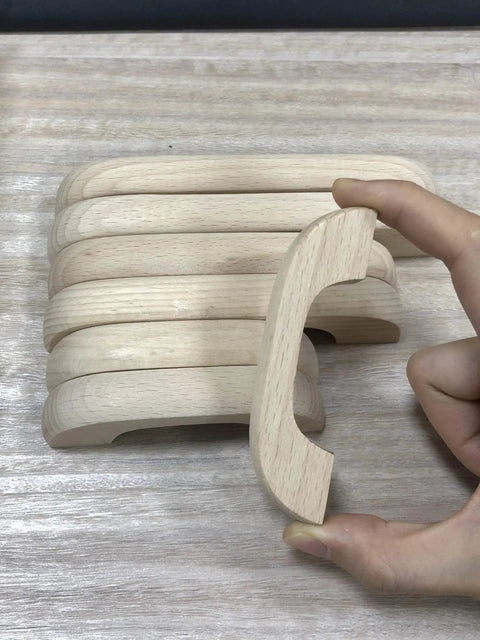Side view of Unfinished Beech Wood Drawer Knob Set 2 Pack, showing smooth, burr-free, paintable surface and hand holding one knob