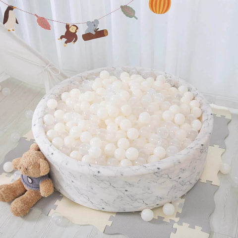 100 Ball Pit Balls Phthalate Free BPA Free Crush Proof Plastic - Beige Colors in a round playpen with teddy bear