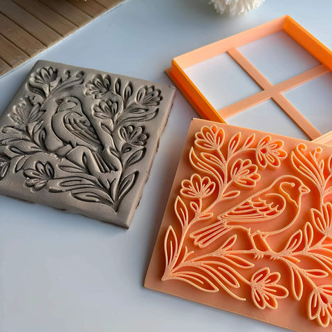 Bird And Floral Harmony Square Tile Cutter And Stamp Tool For Pottery And Ceramic Clay Art 4 Inch By Mouldix, shown with stamped clay design.
