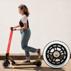 100mm Scooter Replacement Wheels Pair with Ball Bearings Black Pro Stunt Wheels in close-up with rider on scooter