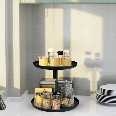 Two Tier Metal Lazy Susan Organizer Rotating Spice Rack For Kitchen Pantry And Countertop Made From 1.2mm Cold Rolled Steel With Powder Coated Finish For Moisture Resistance Smooth 360 Degree Rotation Top 9 Inch Bottom 11 Inch Diameters Black in a kitchen setting.