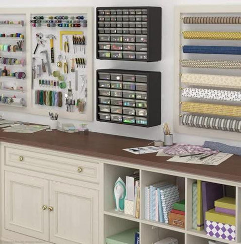 Wall-mounted 24-Drawer Plastic Storage Cabinet For Garage Organization And Craft Storage displayed in a craft room.