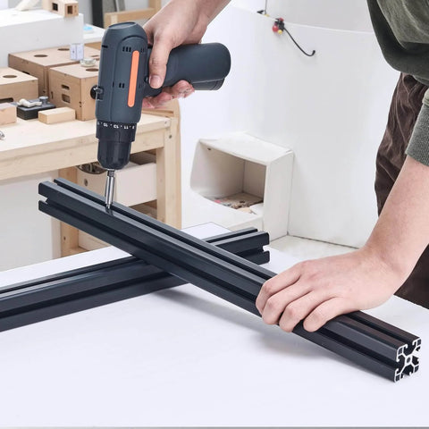 Person assembling 4PCS 23.6 in (600 mm) T Slot 4040 Aluminum Extrusion Profile with drill, black linear rail for CNC, 3D printer setup