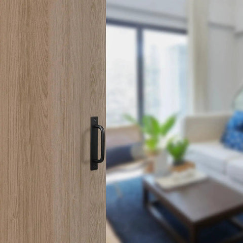 12 Pack Black Barn Door Handles 5.8 Inch Aluminum Alloy Cabinet Pulls With 24 Screws installed on a wooden sliding door in living room.