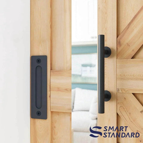 Black handle of 5 FT Heavy Duty Sturdy Sliding Barn Door Hardware Kit, shown installed on wooden door, fit 28''-30" wide panel, I shape hanger.