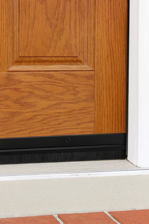 Door Sweeps - Aluminum & Brush - Brush Sweeps for Gaps Up to 1” - Black Trim with Black Brush installed on wood door