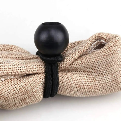 Installed 30 Pack Heavy Duty Bungee Cords 4 Inch Black Rubber Core 4mm Thick Weather Resistant Tie Down Straps securing fabric