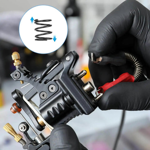 Close-up of hands installing a 30 Pack Compression Springs 13Mm OD, 1.2Mm Wire Size, 15Mm Free Length in a mechanical device.