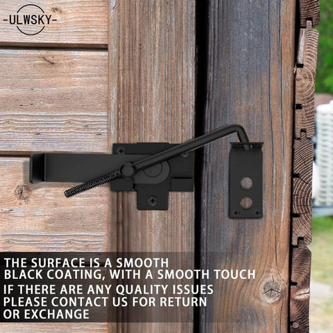 Sliding Door Latch With Hook Black Cam Latch for wooden doors, installed view on a rustic wood door in farm or garden setting.