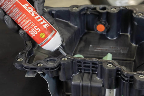 598 Black High Temp RTV Silicone Sealant For Auto Use OEM Approved Performance Engine Building And Repair Grade Heat Resistant Adhesive Sealant Durable Gasket Maker For Intake Exhaust And Engine Surfaces applied to engine part