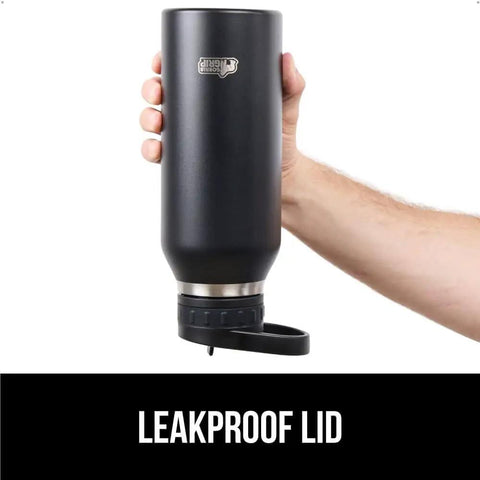 Holding Beast Mode Heavy Duty Stainless Steel Water Bottle 40 Oz Insulated Tumbler With Leakproof Flip Straw Lid in hand