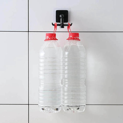 Kitchen Utensil Hanger with 6 Hooks, 2 Pack Under Cabinet Utensil Holder holding two water bottles on a tile wall