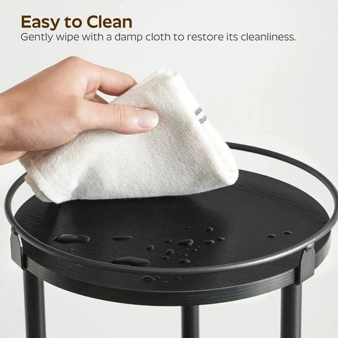 Cleaning the top of Three Tier Lazy Susan Organizer With 360 Degree Rotation Ball Bearing Turntable Spice Rack in Black with cloth