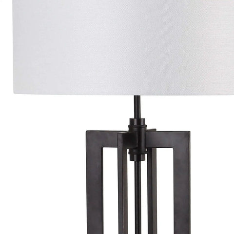 Close-up of the Tanya Tower Floor Lamp By Safavieh, Modern Farmhouse Rustic Industrial Black 59-Inch Standing Lamp base and shade.