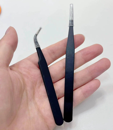Close-up of black Punching Needle Wick Insertion Tools from All In One Candle Making Kit For DIY Fans in hand