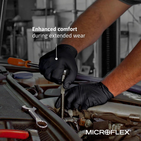 Mechanic wearing Black Nitrile Exam Gloves 4.3 Mil Medium Textured for grip while working on a car engine