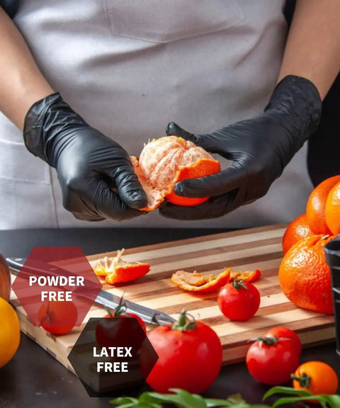 Person using Six Mil Black Nitrile Gloves Textured Grip Latex Free Powder Free XL 100 Count while peeling an orange in kitchen
