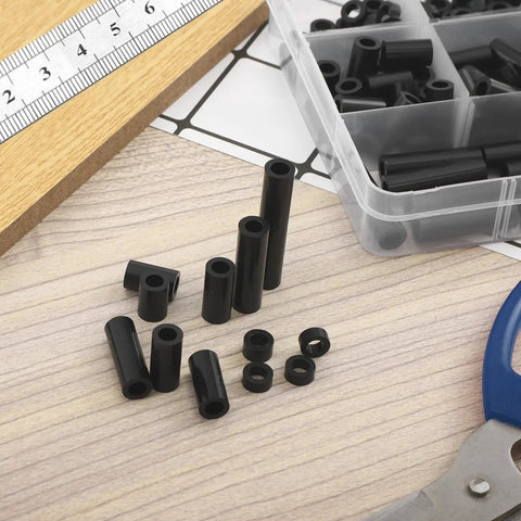 250 Pcs Black Nylon Round Spacer Assortment Kit With 12 Lengths 3mm To 35mm For M6 Screws ID 6mm OD 11mm Non Threaded Plastic Spacers on table