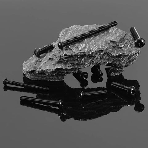 Five Sixteenth By Eighteen Threads Per Inch Button Head Socket Cap Screws displayed on rock surface.