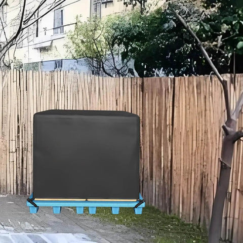 Heavy Duty Water Resistant Pallet Cover With 420D Oxford PU Coated Fabric covering a pallet outdoors against a fence.