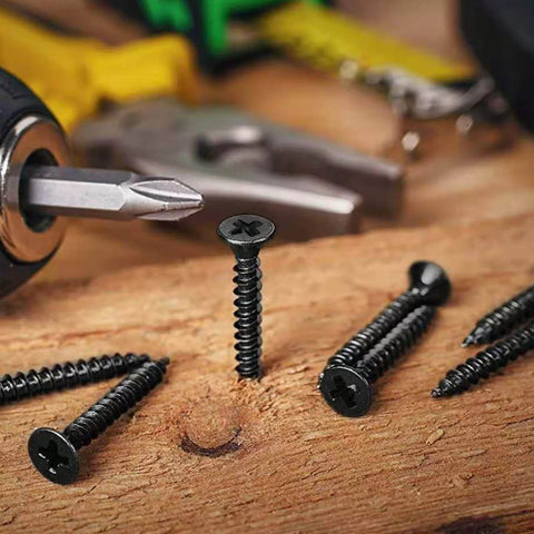 #8 x 3/4 Inch Black Phosphate Stainless Steel Wood Screws, Flat Truss Head Self Tapping Drywall Screws on wooden surface