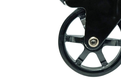Close-up of a single wheel from a 3 Inch Polyurethane Black Mag Designer Caster Set With Non Marking Floor Protection, showing metal spokes.