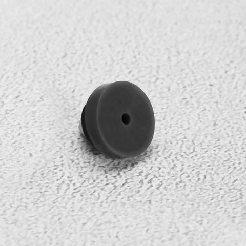 Close-up of one black rubber door silencer from 100 Pcs Rubber Door Silencers For Metal Frame Doors Anti Slam Hinge Outlet