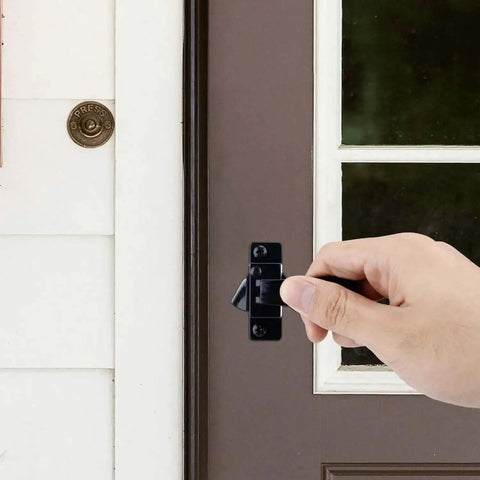 Hand operating Heavy Duty Storm Door Closer And Screen Door Handle Kit In Black For Windy Weather Replacement Parts installed on brown door