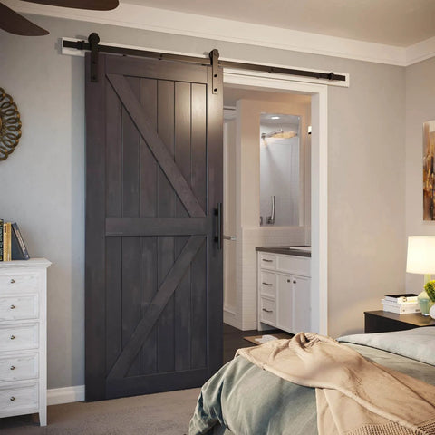 7ft Barn Door Hardware Kit with I shape hanger installed in bedroom doorway, featuring black sliding door track and heavy duty carbon steel.