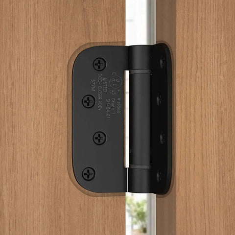 3 Pack Self Closing Door Hinges 4 Inch Black Spring Hinge With 5 Eighths Inch Radius Corner Adjustable Tension installed on wooden door