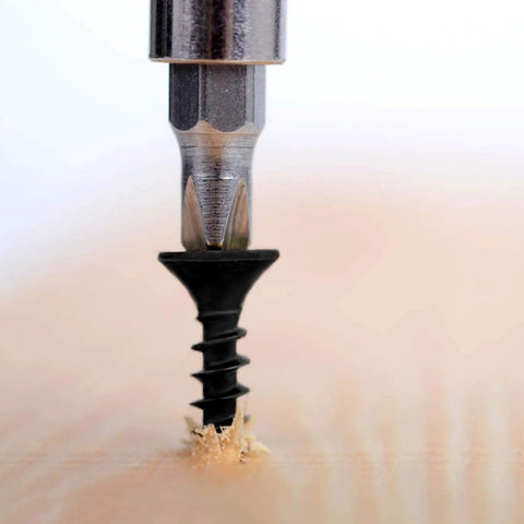#8 x 3/4 Inch Black Phosphate Stainless Steel Wood Screws being drilled into wood surface