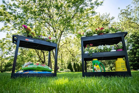 32 Inch Tub Storage Cart With Two Shelves Black Built For Maximum Capacity Ergonomic Top Handle And Super Handy Maneuver Four Swivel Casters With Two Locking Brakes Molded Plastic Shelves And Legs Won't Stain Scratch Dent Or Rust shown in a garden setting