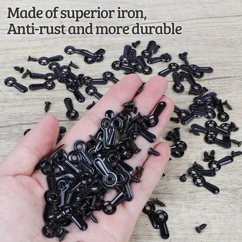 Picture Frame Turn Button Fasteners Set With 100 Backing Clips And 100 Screws For Hanging Pictures Photos And Drawings Black Finish Easy Install And Durable Frame Hardware For Quick Hang By PinCute in hand and scattered on wooden surface
