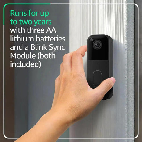 Hand installing Video Doorbell Newest Model With Full HD Head To Toe View And Up To Two Years Battery Life Easy Setup Sync Module Core Included Black System on wall