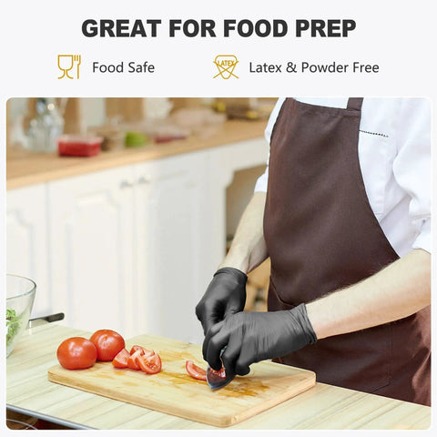 Chef using Black Vinyl Disposable Gloves Latex Free Powder Free Food Grade 100 Large while slicing tomatoes in a kitchen.