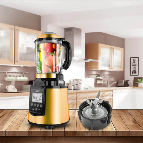 Kitchen blender with gold base and fruit-filled jar, detachable blade set beside it, on a wooden counter in a modern kitchen.