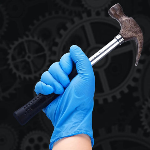 Blue 6 Mil Heavy Duty Nitrile Gloves holding a hammer, showing textured grip, powder-free latex-free, suitable for tough tasks