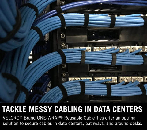 Image of One Wrap Tape For Cable Management Double Sided Reusable Cable Organizer For Installers And Contractors Secure Hold Easy To Install Half Inch By Twenty Five Yard Roll used on blue cables in a data center.