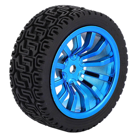 Blue alloy wheel with black rubber tire for RC car or model vehicle, close-up view with detailed tread pattern.