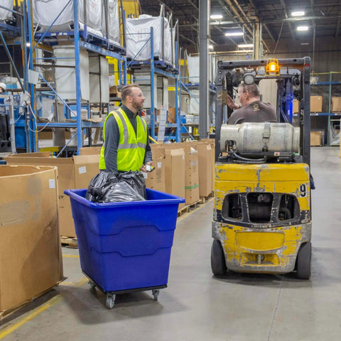 Heavy Duty Commercial Utility Cart Workhorse With 16 Bushel Capacity And 1000 Pound Load Capacity Steel Base And Poly Box Basket On Rolling Wheels For Offices Warehouses Restaurants And More Blue ReadySpace in warehouse being used for material handling.