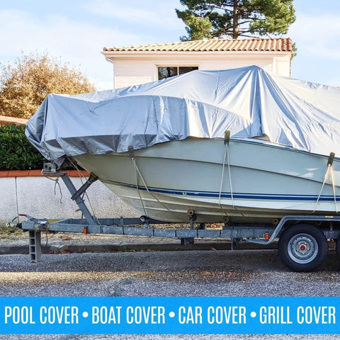 Boat on trailer covered with tarp secured by 24 Pack Heavy Duty Tarp Clips With Lock Grip And Tarp Tie Downs Bungee Cords.