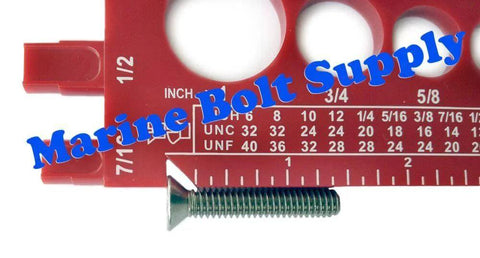 Close-up of a Bolt And Screw Gauge For Standard And Metric Coarse And Fine Diameters Lengths And Thread Pitch with a screw
