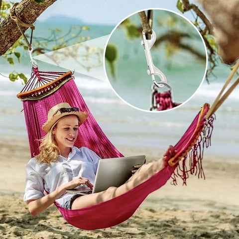 Relaxing in a hammock on the beach with Extra Large 4.7 Inch Double Ended Bolt Snap Hooks With 220lbs Load Capacity for secure hanging.