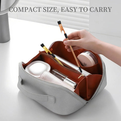 Hand holding Two Pack Bracelet Helper Tool Set With Non Slip Tips For One Handed Clasping Easy To Put On Yourself Jewelry Fastener over open bag.