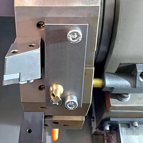 Brass Ball CNC Nozzle 12mm Diameter, 27mm Length with Slanted 4mm Hole installed in machinery, part of high pressure coolant system