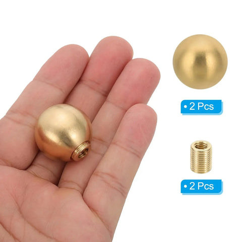 Brass Ball Lamp Finials Caps Knob 25mm 1 Inch 2 Piece Set displayed on a hand with screw cap nut, decorative hardware for lamp shade harp top.