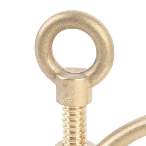 Brass eye bolt with threaded shaft, close-up view of marine deck hardware