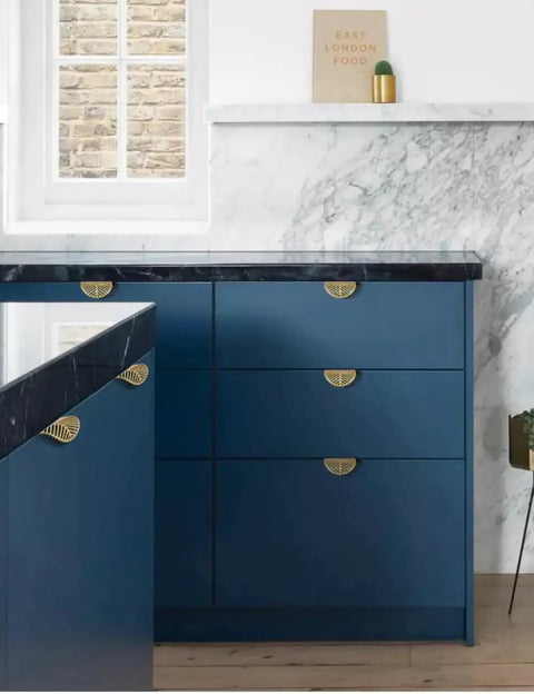 Leaf Shaped Cabinet Handles Set, Solid Brass With Brushed Gold Finish installed on blue kitchen cabinets