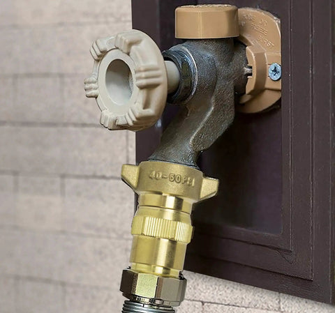 Brass RV Water Pressure Regulator With Filter Screen for Campers and Travel Trailers installed on a water outlet