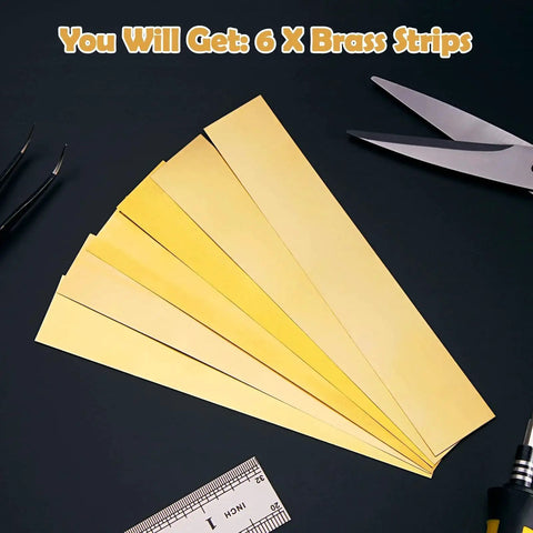 Brass Shim Stock Assortment 1 Inch By 6 Inch 6 Pieces With Thicknesses 0.002 0.004 0.006 0.008 0.012 0.016 Inches on dark surface with tools